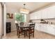Cozy breakfast nook area features tile floors, white cabinetry, and a sunlit window, perfect for enjoying casual meals at 10718 E Vivid Ave, Mesa, AZ 85212