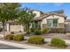 Charming single-Gathering home boasts well-maintained landscaping and a two-car garage, enhanced by solar panels on the roof at 10718 E Vivid Ave, Mesa, AZ 85212
