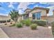 Charming home with a well-maintained front yard, manicured landscaping, and inviting curb appeal at 10718 E Vivid Ave, Mesa, AZ 85212