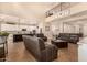 Open-concept living area connects to the kitchen, featuring high ceilings, ample seating, and tile flooring throughout at 10718 E Vivid Ave, Mesa, AZ 85212