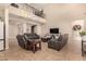 Comfortable living room showcases a soaring ceiling, a wrought iron railing, and an open layout perfect for relaxation and gatherings at 10718 E Vivid Ave, Mesa, AZ 85212
