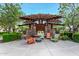 Outdoor lounge area featuring shade canopy, stone accents, and modern seating at 10718 E Vivid Ave, Mesa, AZ 85212
