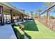 Inviting outdoor community space with lush turf, lounge chairs, and mature landscaping at 10718 E Vivid Ave, Mesa, AZ 85212