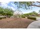 Playground area with a modern jungle gym surrounded by woodchips and landscaping at 10718 E Vivid Ave, Mesa, AZ 85212