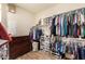 Walk-in closet with an abundance of hanging storage and dresser at 10718 E Vivid Ave, Mesa, AZ 85212
