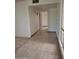 Hallway with decorative tile and carpet at 10721 W Mission Ln, Sun City, AZ 85351