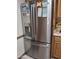 Close-up of a modern, stainless steel refrigerator with a water dispenser and ice maker, adding a touch of elegance at 10721 W Mission Ln, Sun City, AZ 85351