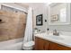 Bathroom showcasing shower-over-tub, stylish vanity, decorative mirror, and neutral color palette at 1120 N Val Vista Dr # 113, Gilbert, AZ 85234