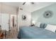 Light filled bedroom with aqua walls and a view to the bathroom through the doorway at 1120 N Val Vista Dr # 113, Gilbert, AZ 85234