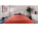 Comfortable bedroom featuring a bright red quilt and a decorative throw pillow at 1120 N Val Vista Dr # 113, Gilbert, AZ 85234