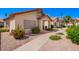 Landscaped front yard with desert flora around this neutral colored single story home at 1120 N Val Vista Dr # 113, Gilbert, AZ 85234