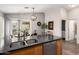 Bright kitchen showcasing granite counters, a stainless steel dishwasher, and a garden view at 1120 N Val Vista Dr # 113, Gilbert, AZ 85234
