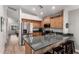 Open-concept kitchen with stainless steel appliances and a breakfast bar at 1120 N Val Vista Dr # 113, Gilbert, AZ 85234