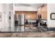 Modern kitchen featuring stainless steel appliances, granite countertops and wood cabinets at 1120 N Val Vista Dr # 113, Gilbert, AZ 85234