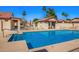 Sparkling community pool surrounded by lush landscaping and comfortable seating, creating a resort-like atmosphere for residents to enjoy at 1120 N Val Vista Dr # 113, Gilbert, AZ 85234
