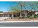 Charming single-story home featuring mature desert landscaping, a two-car garage and neutral exterior at 12366 N 129Th St, Scottsdale, AZ 85259