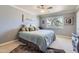 Cozy bedroom with a ceiling fan, picture window and neutral decor at 12927 W Shadow Hills Dr, Sun City West, AZ 85375