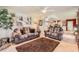 Gathering room featuring two Southwestern-style sofas and a large brown shag rug at 12927 W Shadow Hills Dr, Sun City West, AZ 85375