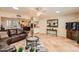 Comfortable living room with an open concept and seamless flow to the kitchen at 12927 W Shadow Hills Dr, Sun City West, AZ 85375