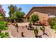 Expansive backyard showcases desert landscaping with cacti, stone features, and manicured shrubs at 1325 E Linda Dr, Casa Grande, AZ 85122