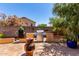 Outdoor cooking is a delight with a built-in BBQ, bench seating, and adjacent smoker at 1325 E Linda Dr, Casa Grande, AZ 85122
