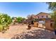Serene backyard featuring a built-in BBQ, bench seating, mature trees and lovely plants at 1325 E Linda Dr, Casa Grande, AZ 85122