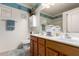 Well-lit bathroom featuring double sinks, wood cabinets, and a neutral color scheme for a clean, modern look at 1325 E Linda Dr, Casa Grande, AZ 85122
