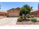 Charming single-story home featuring a desert-landscaped front yard and two-car garage at 1325 E Linda Dr, Casa Grande, AZ 85122