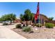 Single-Gathering home showcasing desert landscaping, complemented by a spacious driveway and warm tones at 1325 E Linda Dr, Casa Grande, AZ 85122