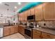 Updated kitchen with stainless steel appliances, stylish tile backsplash, and convenient layout at 1325 E Linda Dr, Casa Grande, AZ 85122