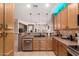 Functional kitchen featuring stainless steel appliances, tiled backsplash, and ample counter space at 1325 E Linda Dr, Casa Grande, AZ 85122