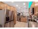 Well-appointed kitchen with stainless steel appliances, custom cabinets, and modern fixtures at 1325 E Linda Dr, Casa Grande, AZ 85122