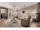 Comfortable living room with tiled floors, plush seating, and a view of the outdoor space at 1325 E Linda Dr, Casa Grande, AZ 85122
