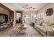 Inviting living room featuring neutral decor, tile floors, and seamless transition to outdoor area at 1325 E Linda Dr, Casa Grande, AZ 85122