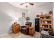 Cozy office area featuring tile floors, built-in shelving, and a comfortable seating area, perfect for working from home at 1325 E Linda Dr, Casa Grande, AZ 85122