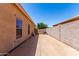 Spacious side yard with concrete, a wall, a privacy gate, and an A/C unit at 1325 E Linda Dr, Casa Grande, AZ 85122