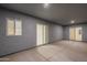 Spacious back patio featuring sliding glass doors, enhancing indoor-outdoor living at 13430 S Garnet Rd, Buckeye, AZ 85326