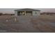 Home's covered patio space ready for custom landscaping, set against the desert horizon at 13430 S Garnet Rd, Buckeye, AZ 85326