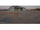 Home's covered patio area awaits personalized landscaping and outdoor enjoyment at 13430 S Garnet Rd, Buckeye, AZ 85326