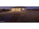 Newly built home with covered patio and large backyard ready for landscaping at 13430 S Garnet Rd, Buckeye, AZ 85326