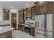 Well-appointed kitchen featuring stainless steel appliances and ample cabinet space at 13430 S Garnet Rd, Buckeye, AZ 85326