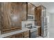 Close up of kitchen showcasing stainless steel appliances and beautiful wood cabinetry at 13430 S Garnet Rd, Buckeye, AZ 85326