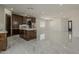 Kitchen with island, stainless appliances, and tile floors at 13430 S Garnet Rd, Buckeye, AZ 85326