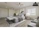Well-lit main bedroom with a king-sized bed and stylish decor at 13430 S Garnet Rd, Buckeye, AZ 85326