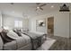 Spacious main bedroom suite with seating area and large windows at 13430 S Garnet Rd, Buckeye, AZ 85326
