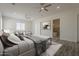 Spacious main bedroom suite with seating area and large windows at 13430 S Garnet Rd, Buckeye, AZ 85326