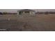 Modern home with a covered patio, desert landscape, and mountain views at 13430 S Garnet Rd, Buckeye, AZ 85326
