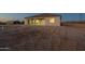 Modern home exterior featuring a covered patio, gray siding, and mountain views at 13430 S Garnet Rd, Buckeye, AZ 85326