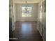 Bright dining area featuring wood-look floors and a modern chandelier at 14038 N 162Nd Ln, Surprise, AZ 85379