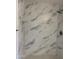 Elegant shower with marble-look tile and modern fixtures at 14038 N 162Nd Ln, Surprise, AZ 85379